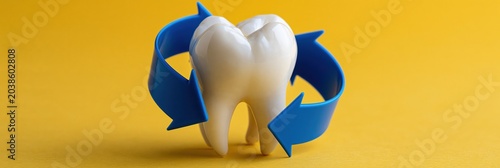 Tooth with circular blue arrows on yellow background for dental recycling and oral health banner design