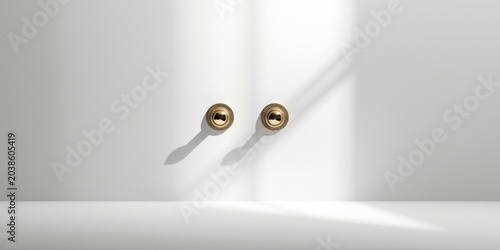 Decorative brass door handles staged on an uncluttered white background with copy space for text