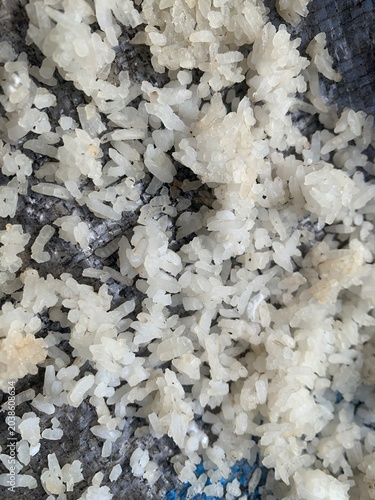 Leftover rice is dried in the sun on a bamboo tray, in Indonesia it is called nasi aking
