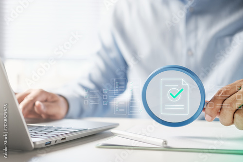 Photos Professional document verification and compliance audit process, digital checkli