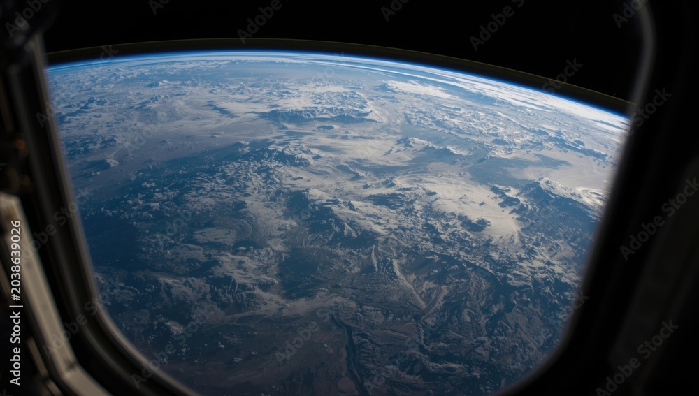 Naklejka premium Earth's continents visible from the space station window frame