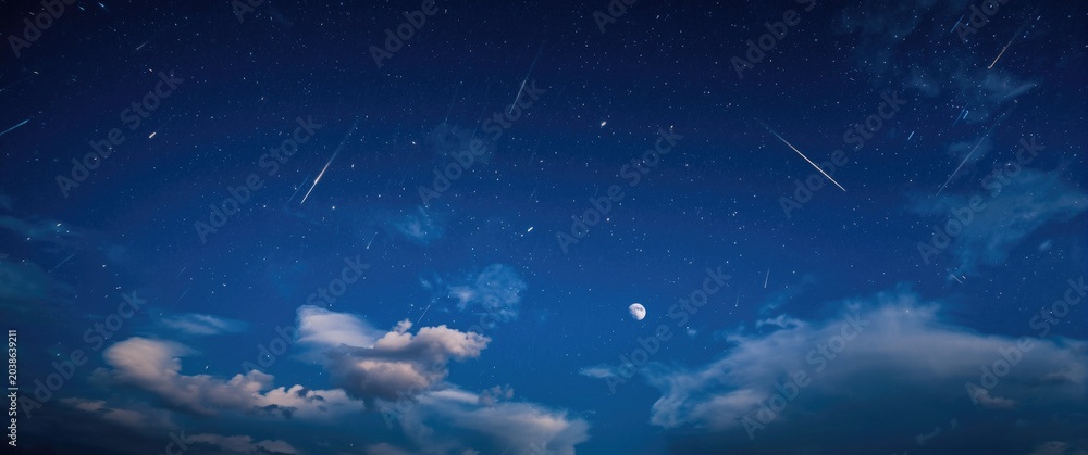 Fototapeta premium Colorful night atmosphere displaying a deep navy backdrop with multiple shooting stars passing through light clouds