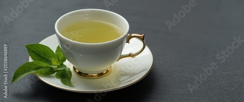 Green tea poured into an el...