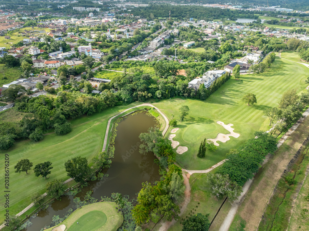 Obraz premium Aerial view drone shot of beautiful golf field in Phuket island Thailand