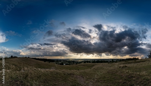 Dramatic Black Clouds Over An Expansive Sky In Hdr Panorama