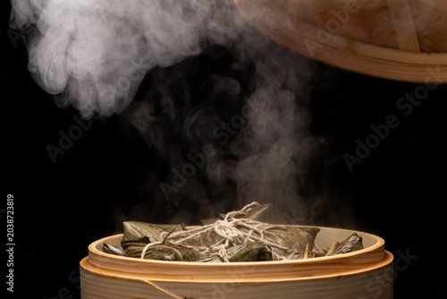 The piping hot traditional handmade meat dumplings are fresh out of the steamer.
