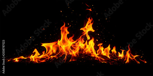 Fotografie A blazing orange and red fire burns fiercely against a black background, casting