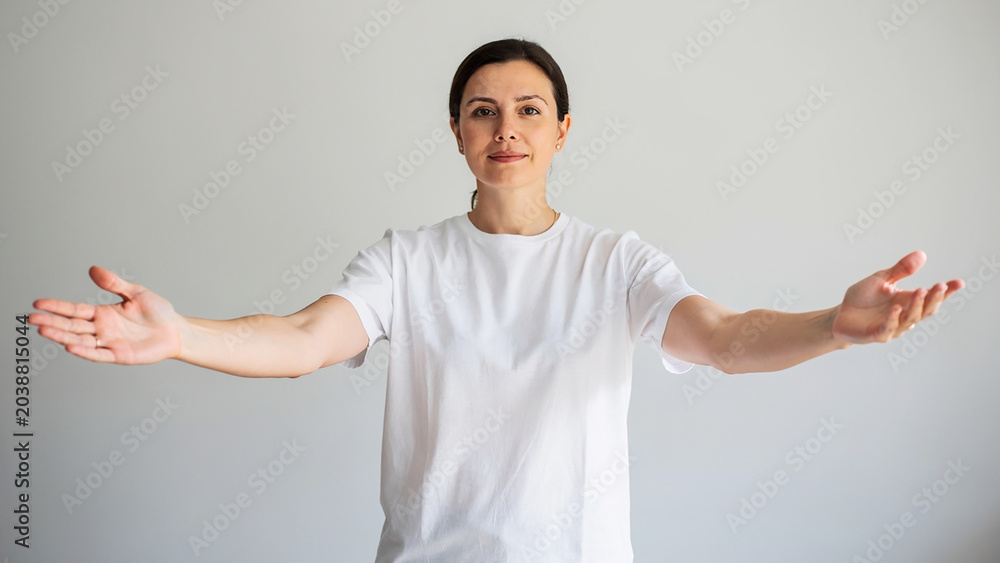 Fototapeta premium Asian man showing various expressions: confusion, happiness, anger, smiling, pointing, folding hands, crossing arms, performing stop gesture, folding hands in prayer, opening mouth, opening hands