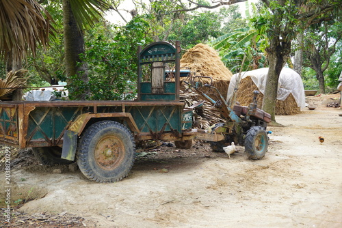 Obraz na plátně A traditional power tiller trolley parked in a rural village courtyard
