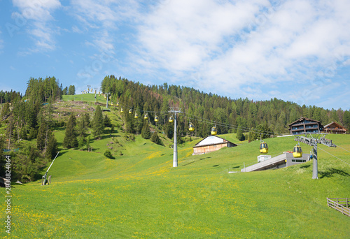 Piz Sorega cable car with circulating gondolas. spring landscape St. Kassian, dolomites alps