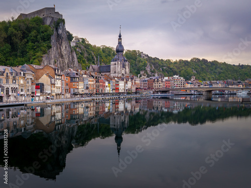 Aerial view of the Collegiate Church of Notre-Dame and the Citadel on a rocky cliff overlooking the Meuse river in Dinant, Wallonia, Belgium.