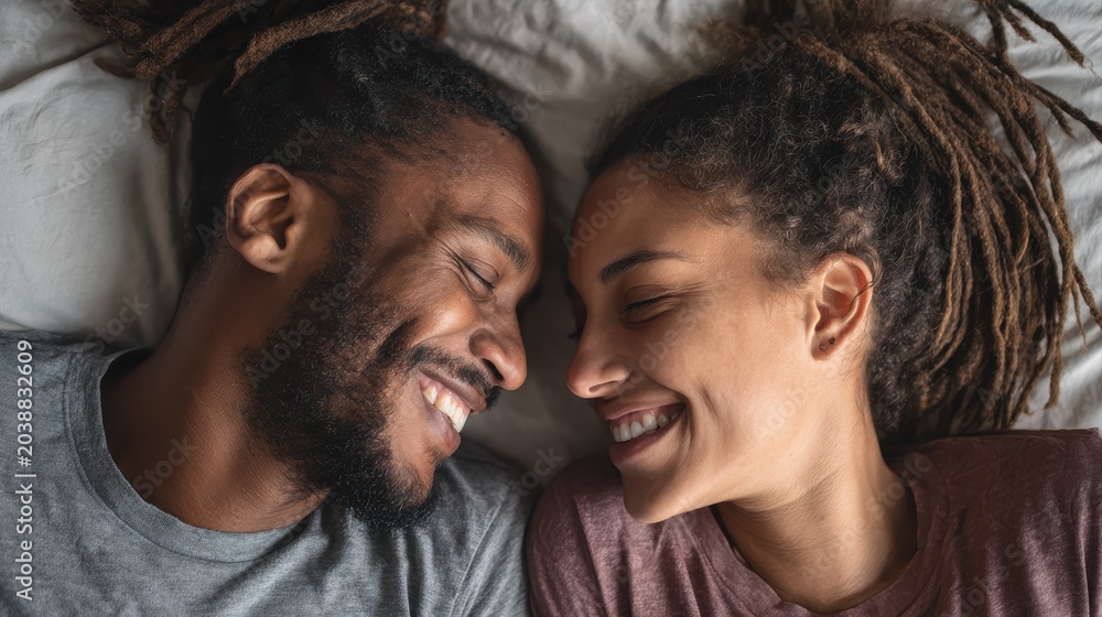 Obraz premium A happy couple in love communicate face-to-face while relaxing in bed.