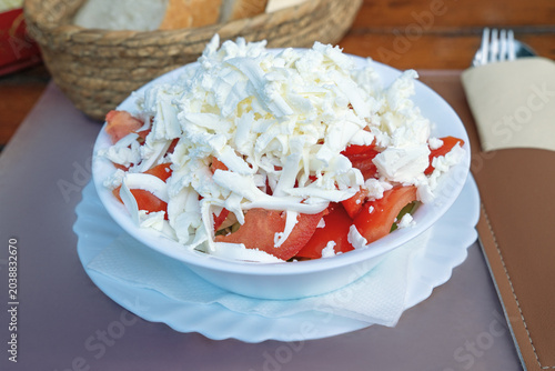 Shopska salad, traditional Balkan vegetable salad with cheese