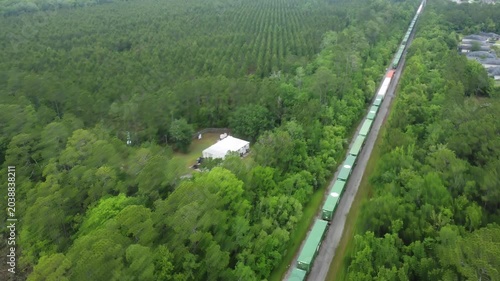 Train going through Florida wilderness drone view