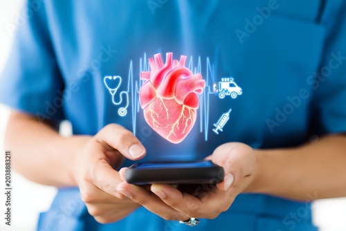 Medical professional views hologram of human heart on smartphone