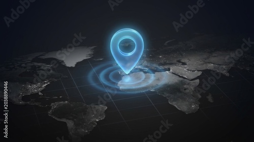 Holographic 3D map with a glowing location pin marker on dark background.
