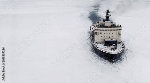 Icebreaker Ship Moving Through Frozen Arctic Sea Aerial Perspective