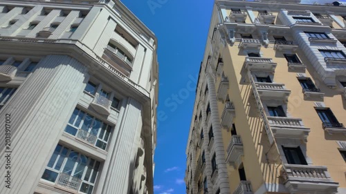 Madrid city center tourist bus tour, first-person POV from top deck.