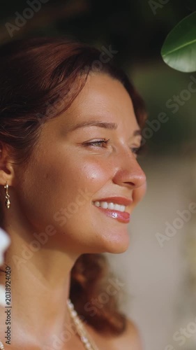 Woman Smiling Peacefully in Sunlight Close-Up Shot
