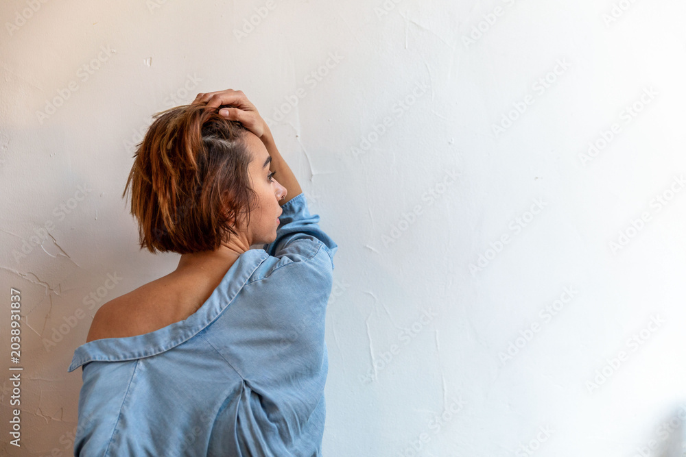 Naklejka premium Woman in blue shirt posing.