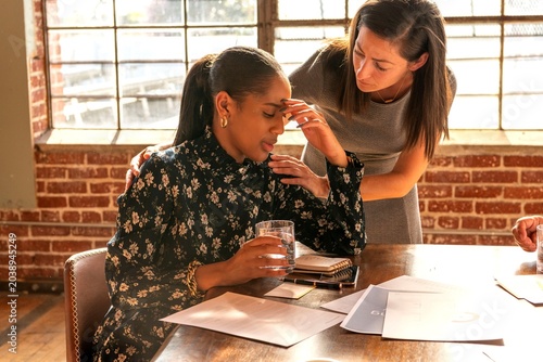 Photography Supportive workplace interaction captured beautifully.