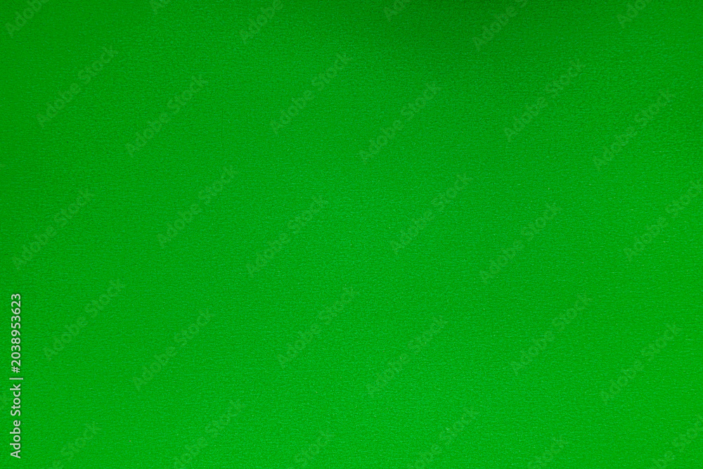 Fototapeta premium Solid green textured surface background for chroma key editing design