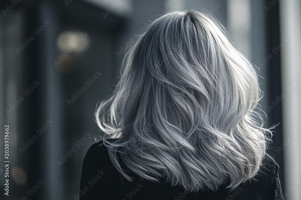 Naklejka premium Back view of woman with beautiful silver gray hair. Generative Ai, AI generated