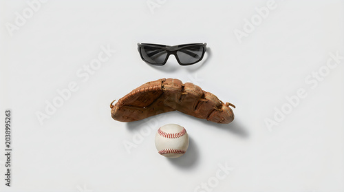 Baseball mitt and ball with sunglasses forming a funny dad joke face