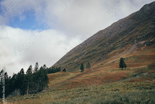 Hiking through the dramatic mountain pass of Glen Coe, Scottish Highlands