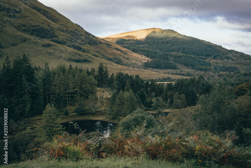 Obraz na płótnie Hiking through the dramatic mountain pass of Glen Coe, Scottish Highlands