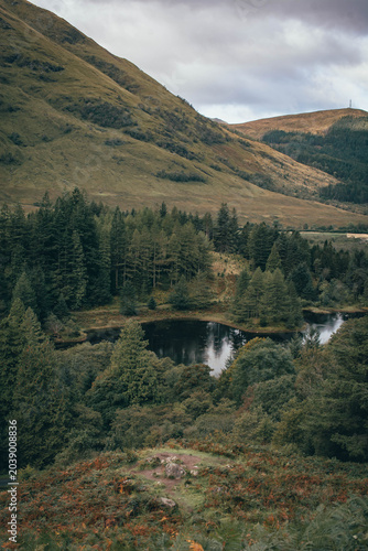 Hiking through the dramatic mountain pass of Glen Coe, Scottish Highlands