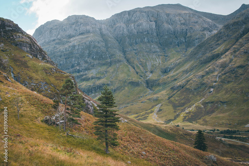 Hiking through the dramatic mountain pass of Glen Coe, Scottish Highlands