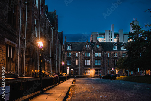 Atmospheric Glasgow street at twilight with glowing city lights, Scotland