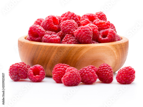 Ripe raspberries in wooden bowl isolated on white background