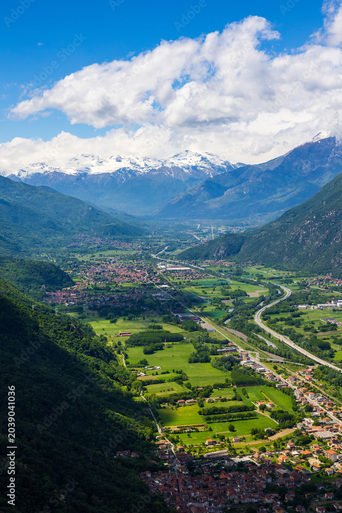 Fototapeta premium Panoramic view of the Susa Valley marked by the A32 motorway (Autostrada del Frejus) from the Sacra di San Michele abbey perched on Mount Pirchiriano