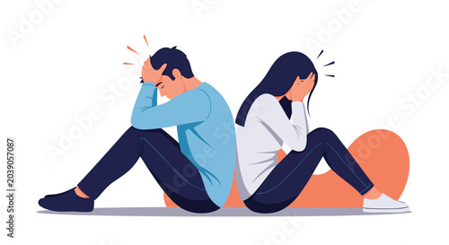Sad young man and woman sitting back to back on the floor experiencing relationship problems and emotional distress.