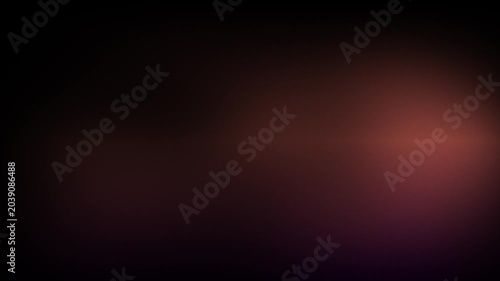 Animation abstract soft gradient light leaks loop motion background on black background. Blurry abstract background with orange light.