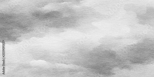 An abstract watercolor painting depicts soft, diffused gray clouds against a textured white background, evoking a sense of calm and atmospheric depth.