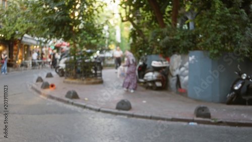 Photos Soft blurred street scene with shallow bokeh, defocused cafe terrace, scooters and trees, outdoor; background backplate copyspace calm