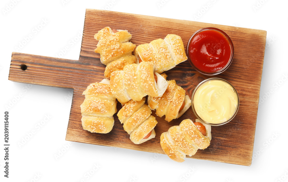 Naklejka premium Puff pastry. Tasty sausages in dough and sauces isolated on white, top view