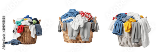 Obraz na plátně Set of Three Wicker Laundry Baskets Filled with Colorful Dirty Clothes Isolated