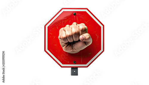 A clenched fist emerges from a red stop sign.