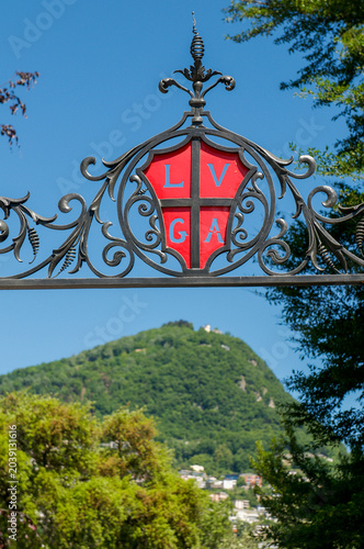 Obraz na plátně Lugano city official coat of arms emblem with red and white cross in Ticino Swit