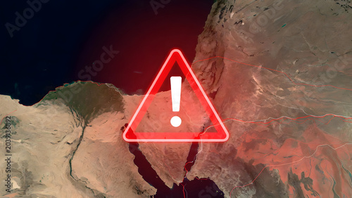 Satellite view of the Strait of Hormuz with a red warning symbol and digital lines. Concept of geopolitical tension, oil supply risks, maritime security, and global trade instability in the Gulf.