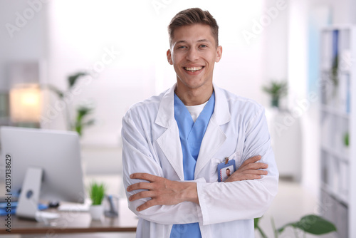 Foto Portrait of medical assistant in white coat at clinic
