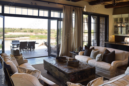Cozy living room design  earthy tones, oversized stone coffee table, and natural textured elements