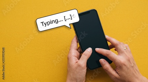 Hands Using Mobile Phone Yellow Background Messaging App