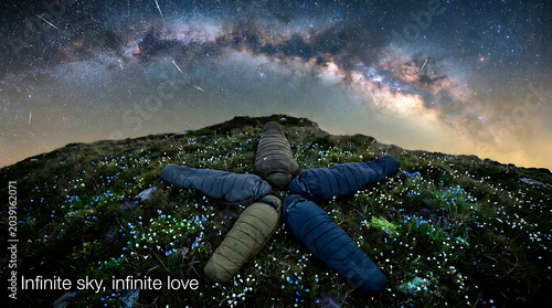 Multiracial Family Watching Meteor Shower Lying in Alpine Meadow — Night Sky Family Moment Stock Photo