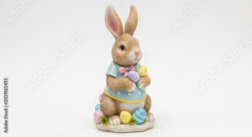 Pastel Easter Bunny Figurine with Colorful Eggs on Pedestal.