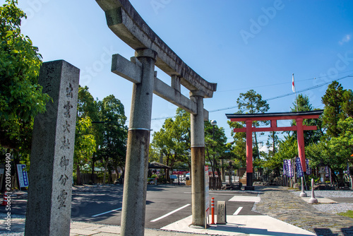Stone Torii of Ogaki Hachiman Shrine, this shinto shrine rebuilt in the 1950s ,with orange red torii on the back